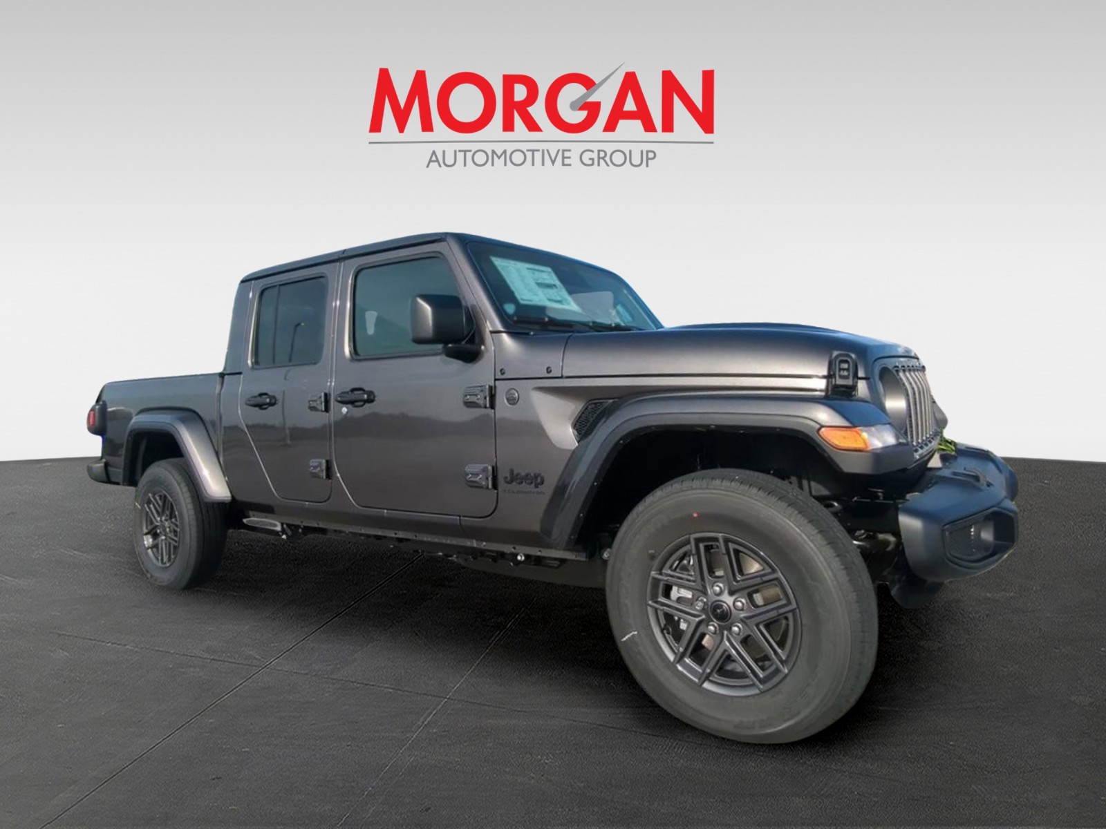 2026 Jeep Gladiator Sport S in Gray — front three-quarter view