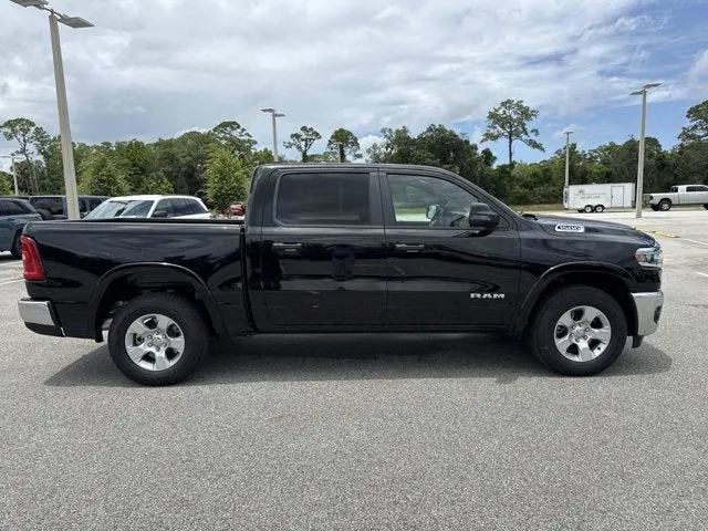 2026 RAM 1500 Big Horn in Diamond Black Crystal Pearlcoat — front three-quarter view