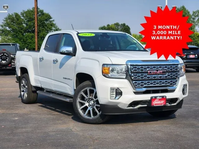 2022 GMC Canyon 4WD Denali in Summit White — front three-quarter view