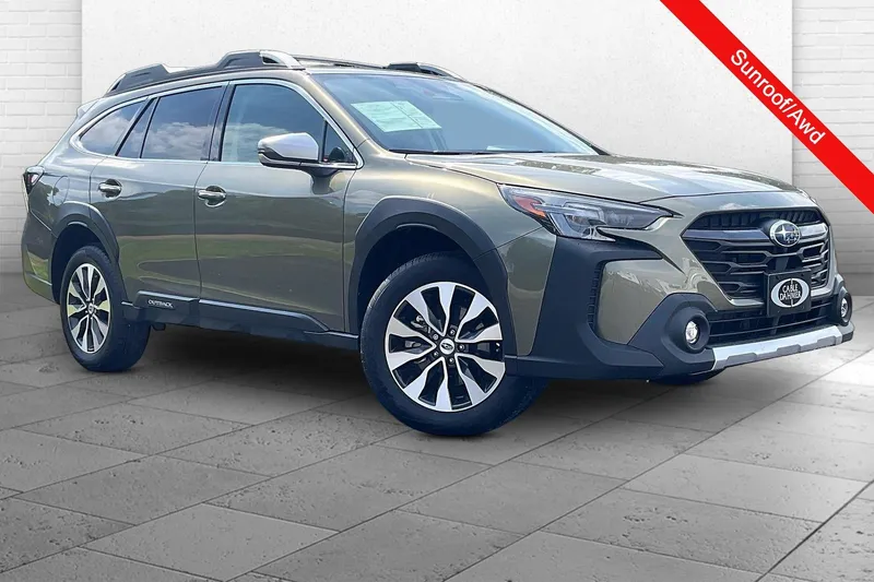 2025 Subaru Outback Touring in Autumn Green Meta — front three-quarter view