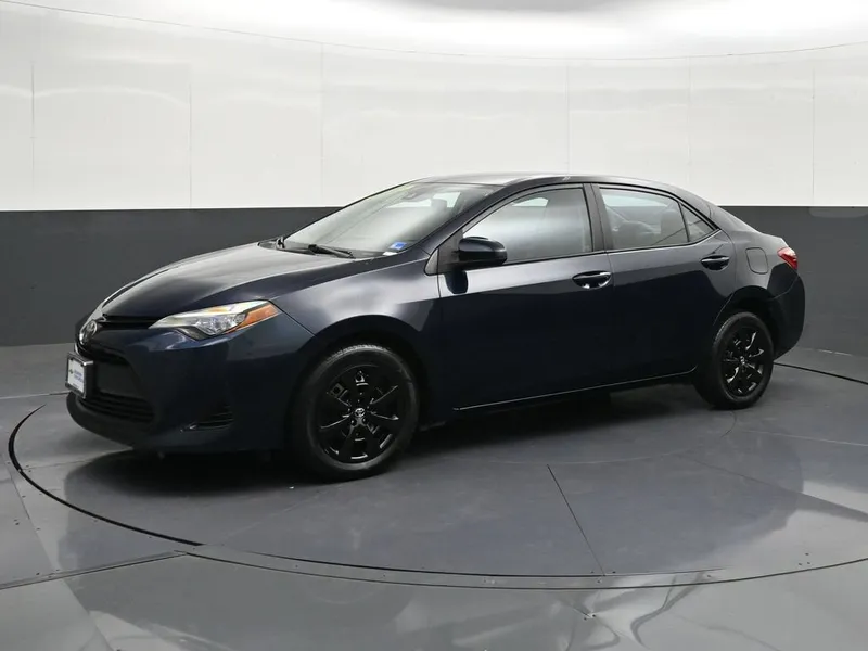 2017 Toyota Corolla L in Galactic Aqua Mic — front three-quarter view