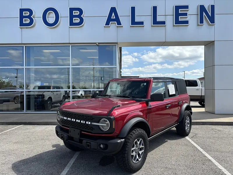 2025 Ford Bronco Badlands in Ruby Red Metallic Tinted Clearcoat — front three-quarter view