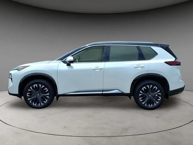 2024 Nissan Rogue Platinum in Everest White Pearl — front three-quarter view