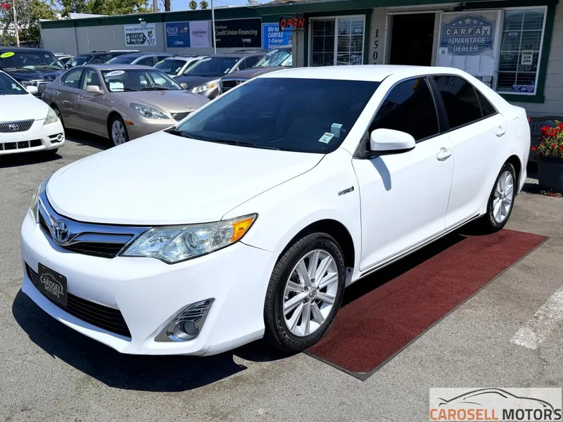 2014 Toyota Camry Hybrid in White — front three-quarter view