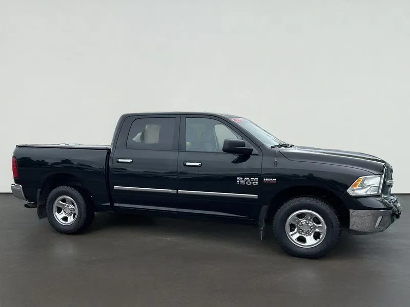 2017 RAM 1500 SLT in Black Forest Green Pearlcoat — front three-quarter view