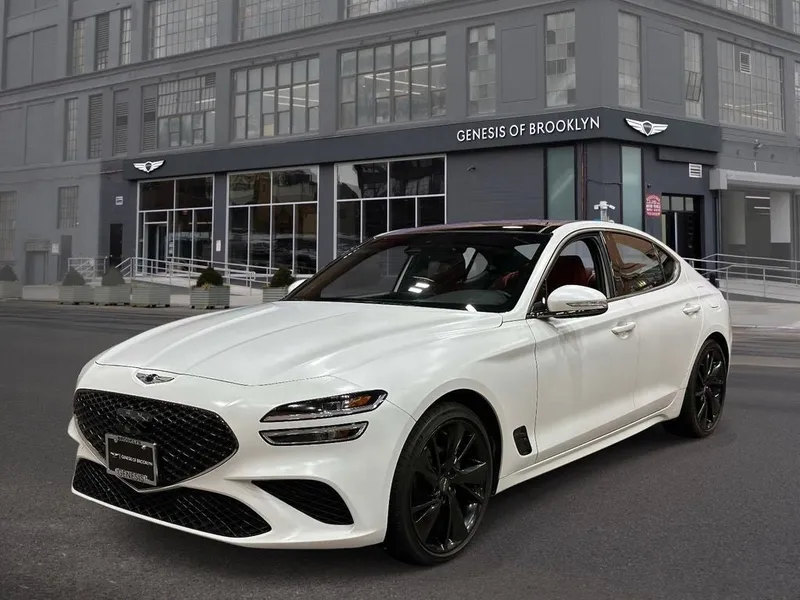 2023 Genesis G70 2.0T Sport Prestige in Verbier White — front three-quarter view