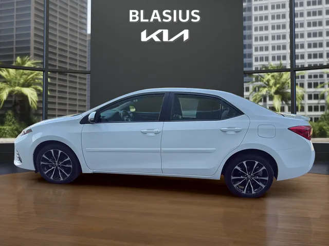2019 Toyota Corolla SE in Super White — front three-quarter view