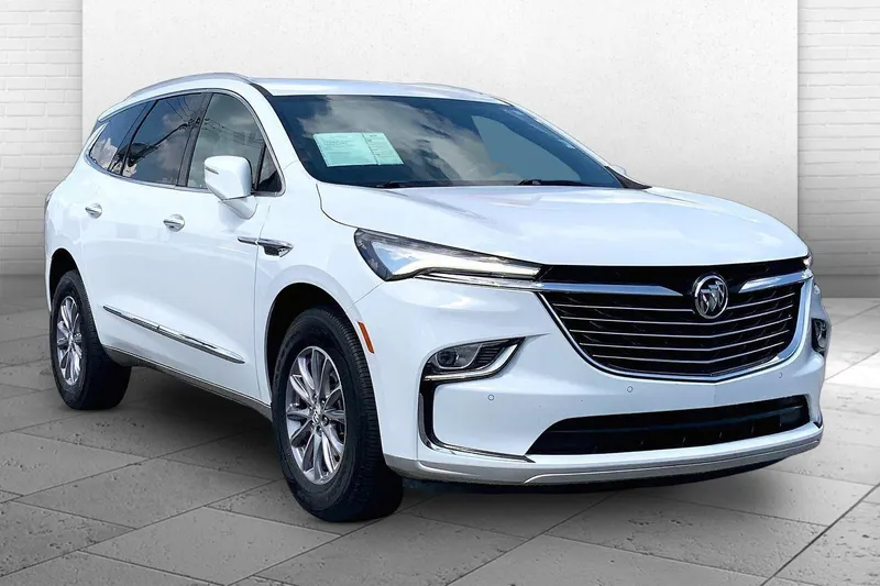 2023 Buick Enclave Essence in Summit White — front three-quarter view