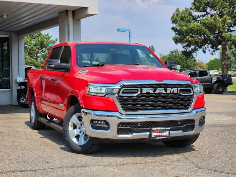 2025 RAM 1500 Big Horn Crew Cab 4x4 5'7' Box in Flame Red Clearcoat — front three-quarter view