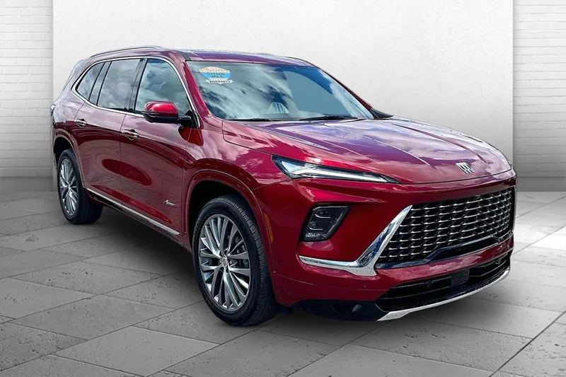 2025 Buick Enclave Avenir in Cherry Red Tintcoat — front three-quarter view