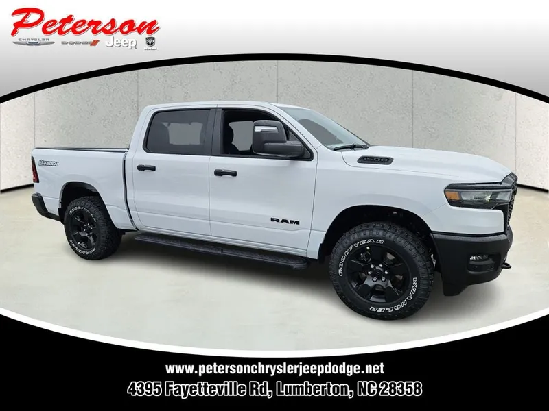 2026 RAM Ram 1500 RAM 1500 WARLOCK CREW CAB 4X4 5'7' BOX in Bright White Clear-Coat Exterior Paint — front three-quarter view