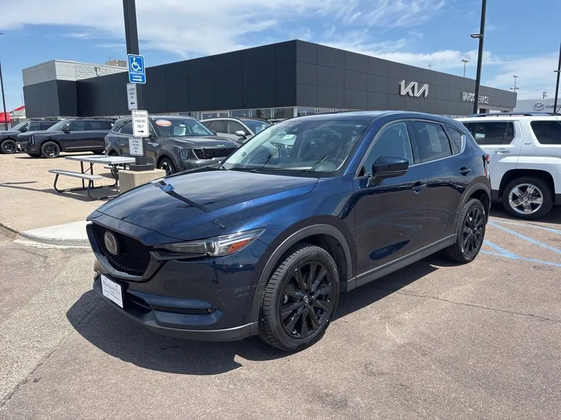 2021 Mazda Mazda CX-5 Grand Touring in Deep Crystal Blue Mica — front three-quarter view