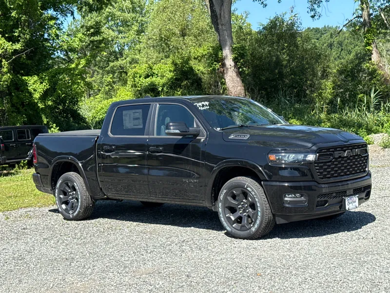 2026 RAM 1500 Big Horn in Diamond Black Crystal Pearlcoat — front three-quarter view
