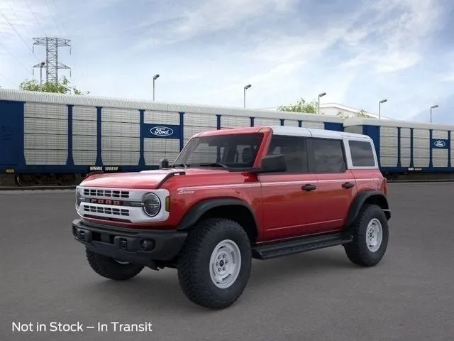 2026 Ford Bronco Heritage Edition in Ruby Red Metallic Tinted Clearcoat — front three-quarter view
