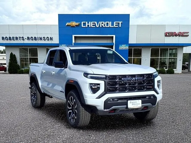 2026 GMC Canyon AT4 in Summit White — front three-quarter view