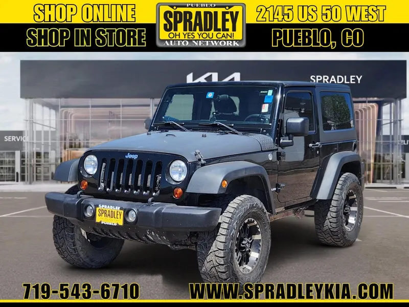 2013 Jeep Wrangler Sport in Black — front three-quarter view