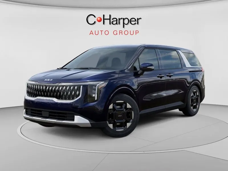 2026 Kia Carnival EX in Deep Chroma Blue — front three-quarter view