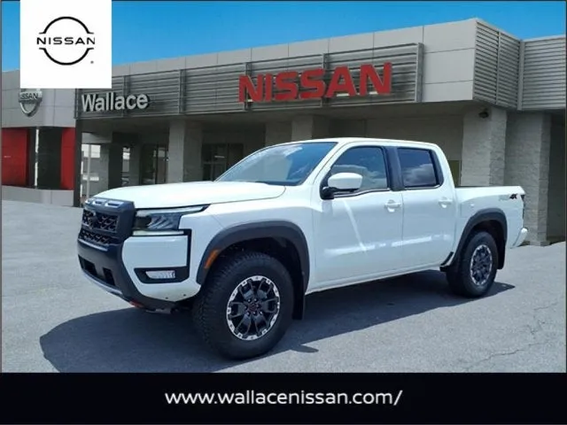 2026 Nissan Frontier PRO-4X in Glacier White Qak — front three-quarter view