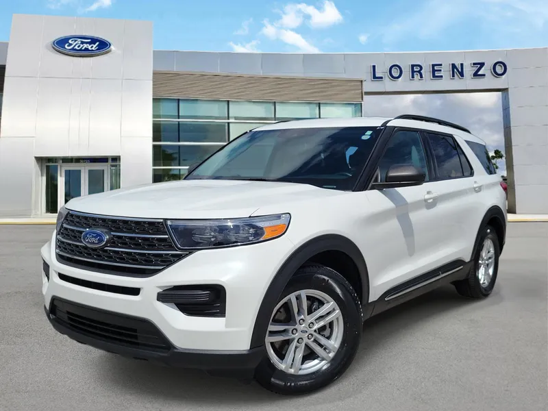 2023 Ford Explorer XLT in Star White Metallic Tri-Coat — front three-quarter view