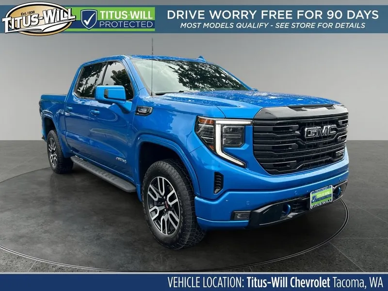 2024 GMC Sierra 1500 AT4 in Dynamic Blue Metallic — front three-quarter view