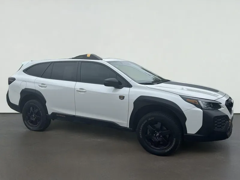 2025 Subaru Outback Wilderness in Crystal White Pearl — front three-quarter view