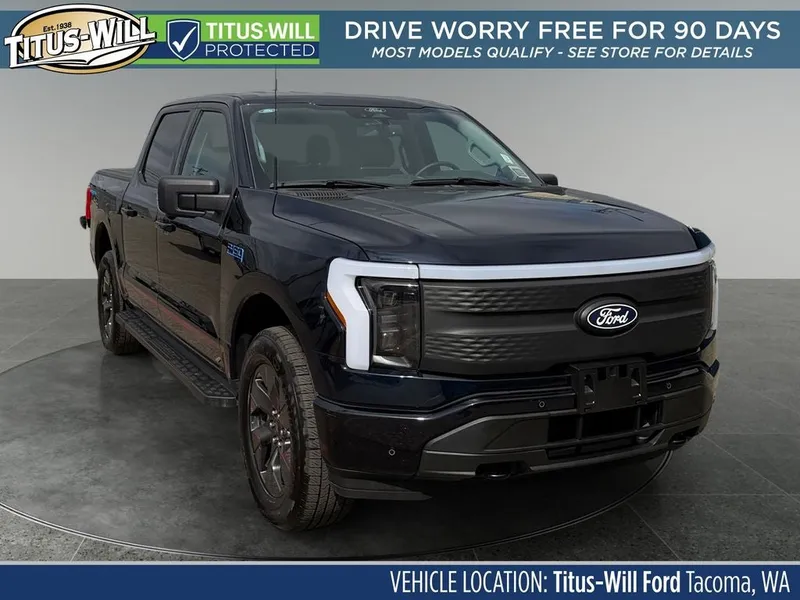 2025 Ford F-150 Lightning Flash in Blue Metallic — front three-quarter view