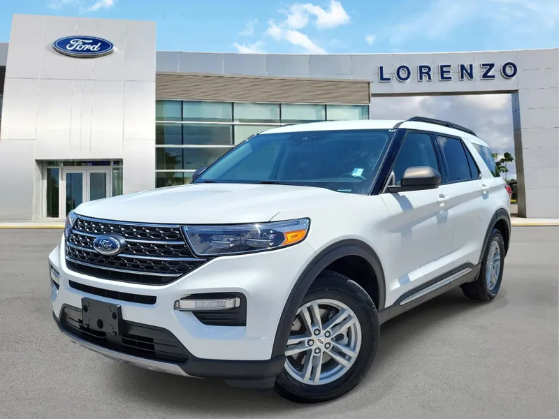 2023 Ford Explorer XLT in Star White Metallic Tri-Coat — front three-quarter view