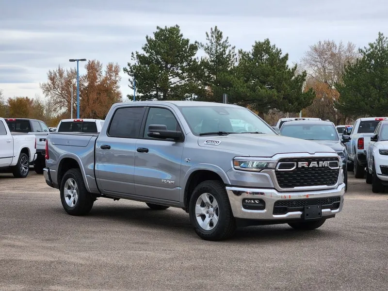 2026 RAM 1500 RAM 1500 BIG HORN CREW CAB 4X4 5'7' BOX in Billet Silver Metallic Clear-Coat Exterior Paint — front three-quarter view
