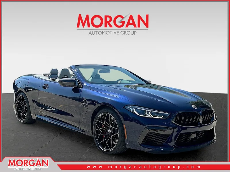 2023 BMW M8 Competition in Tanzanite Blue II Metallic — front three-quarter view