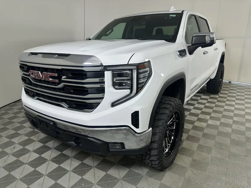 2025 GMC Sierra 1500 SLT in Summit White — front three-quarter view