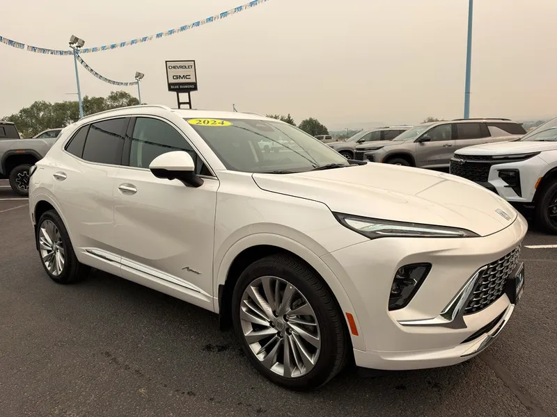 2024 Buick Envision Avenir in White Frost Tricoat — front three-quarter view
