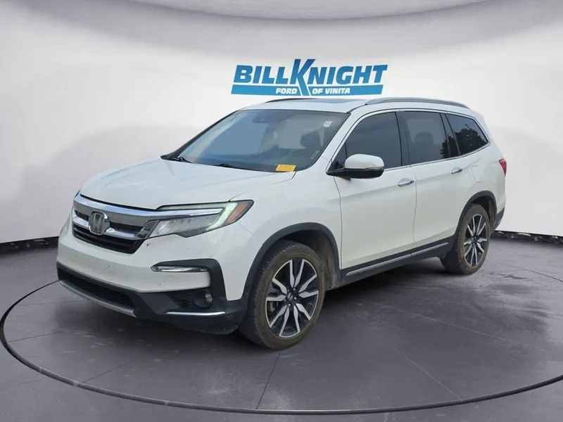 2019 Honda Pilot Elite in White — front three-quarter view