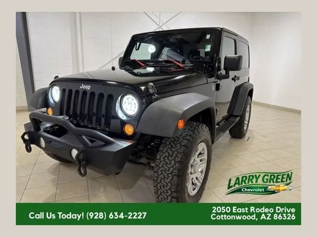 2014 Jeep Wrangler Sport in Black — front three-quarter view