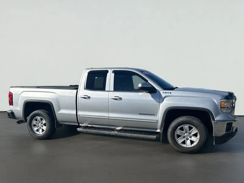 2015 GMC Sierra 1500 SLE in Quicksilver Metallic — front three-quarter view