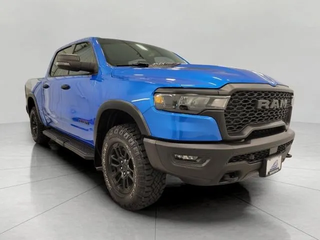 2025 RAM 1500 Rebel 4x4 Crew Cab 5'7 Box in Hydro Blue Pearlcoat — front three-quarter view