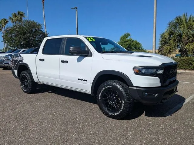 2025 RAM 1500 Rebel in Bright White Clearcoat — front three-quarter view