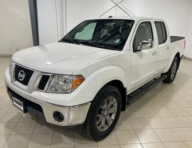 2019 Nissan Frontier SL in Glacier White — front three-quarter view