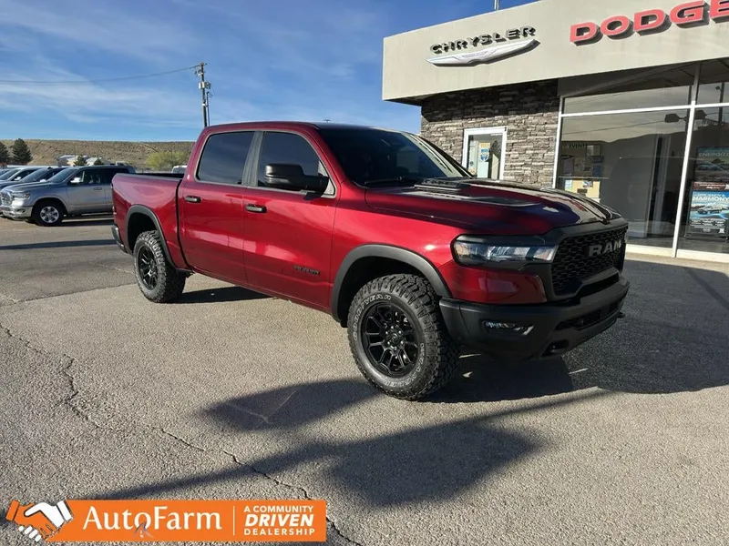 2025 RAM 1500 Rebel in Delmonico Red Pearlcoat — front three-quarter view