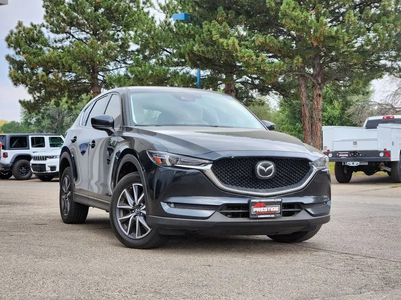 2018 Mazda Mazda CX-5 Grand Touring in Jet Black Mica — front three-quarter view