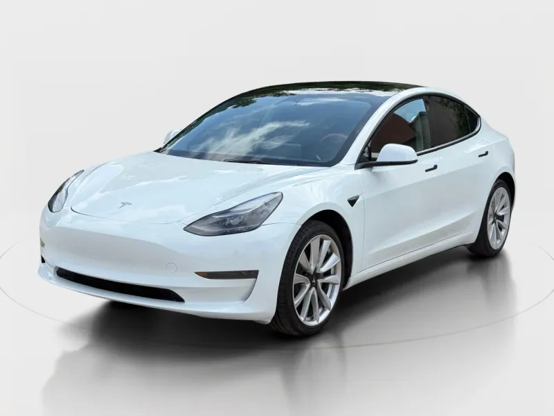 2023 Tesla Model 3 Rear-Wheel Drive in Pearl White Multi-Coat — front three-quarter view