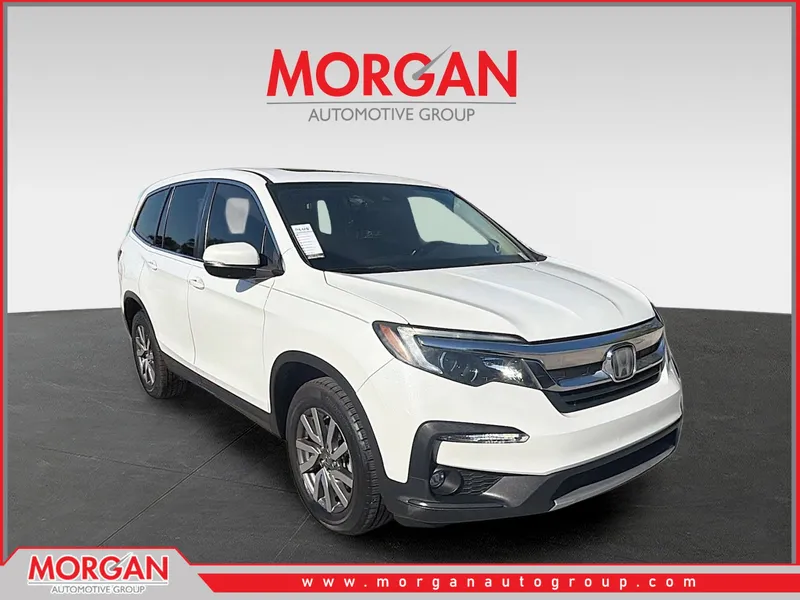 2021 Honda Pilot EX-L in White — front three-quarter view