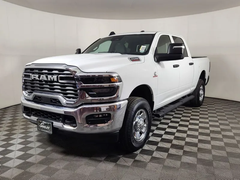 2025 RAM 2500 RAM 2500 TRADESMAN CREW CAB 4X4 6'4' BOX in Bright White Clear-Coat Exterior Paint — front three-quarter view