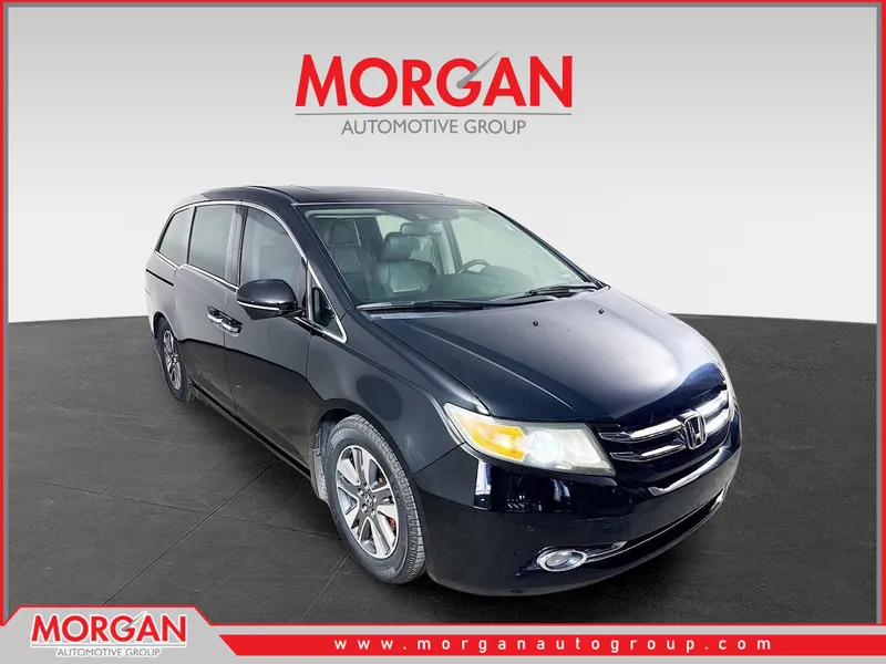 2015 Honda Odyssey Touring in Black — front three-quarter view