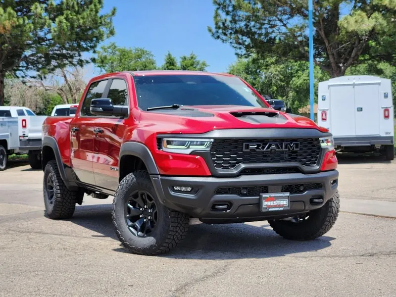 2026 RAM 1500 RAM 1500 RHO CREW CAB 4X4 5'7' BOX in Molten Red Pearl-Coat Exterior Paint — front three-quarter view