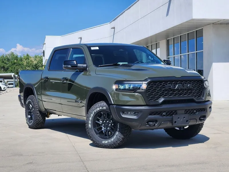2026 RAM 1500 RAM 1500 REBEL CREW CAB 4X4 5'7' BOX in Tank Exterior Paint — front three-quarter view