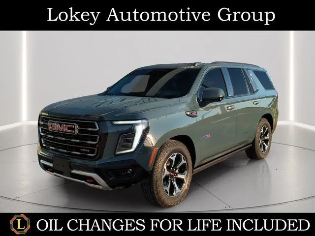2025 GMC Yukon AT4 in Midnight Pine — front three-quarter view
