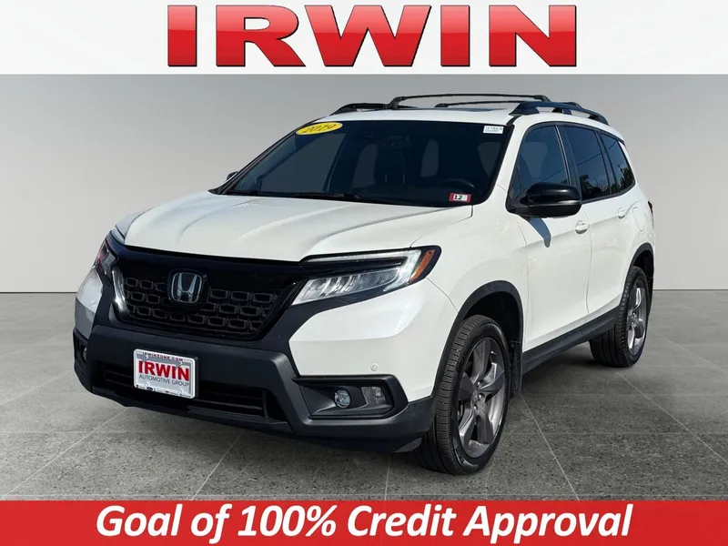 2019 Honda Passport Touring in White — front three-quarter view