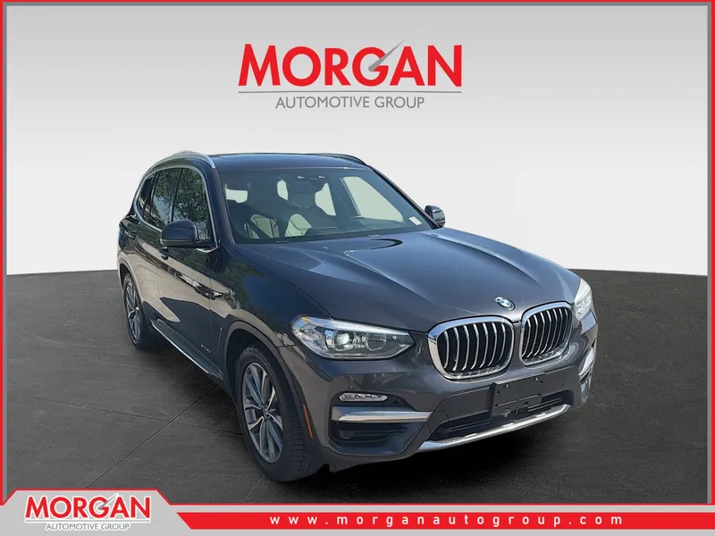 2018 BMW X3 xDrive30i in Dark Graphite — front three-quarter view