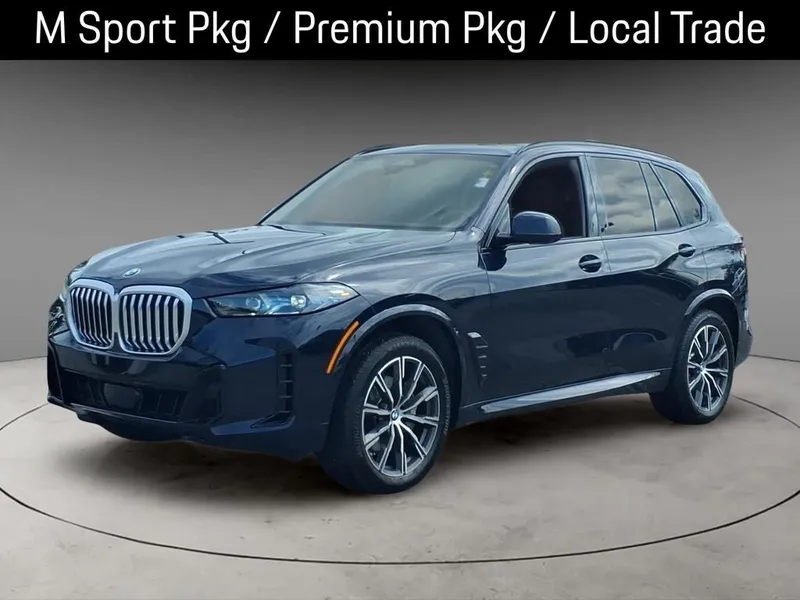 2024 BMW X5 xDrive40i in Carbon Black Metallic — front three-quarter view