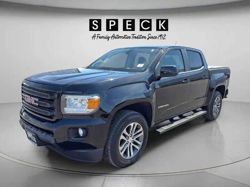2016 GMC Canyon 4WD SLE in Onyx Black — front three-quarter view